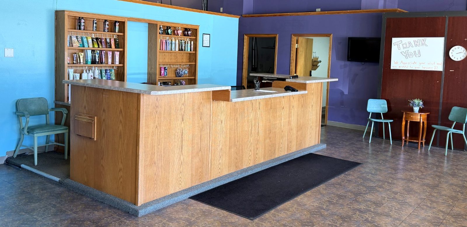 Our front counter and lobby, with the lotion wall and guest seating