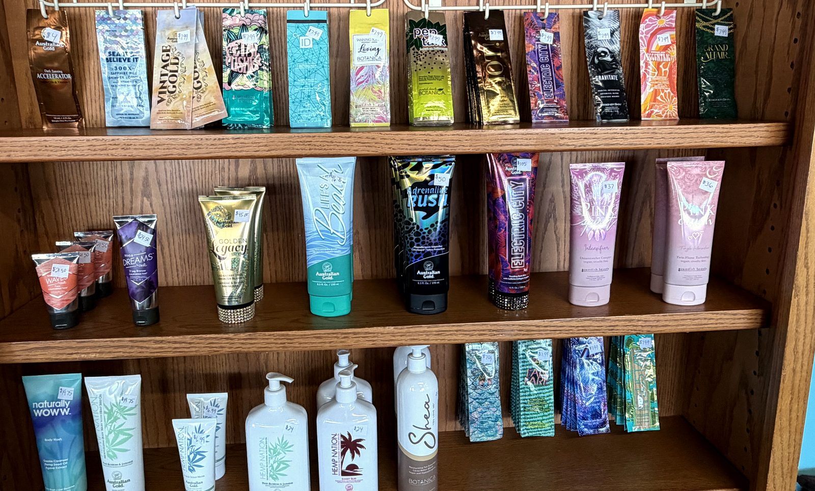 Our wall of tanning lotions and single-use packets